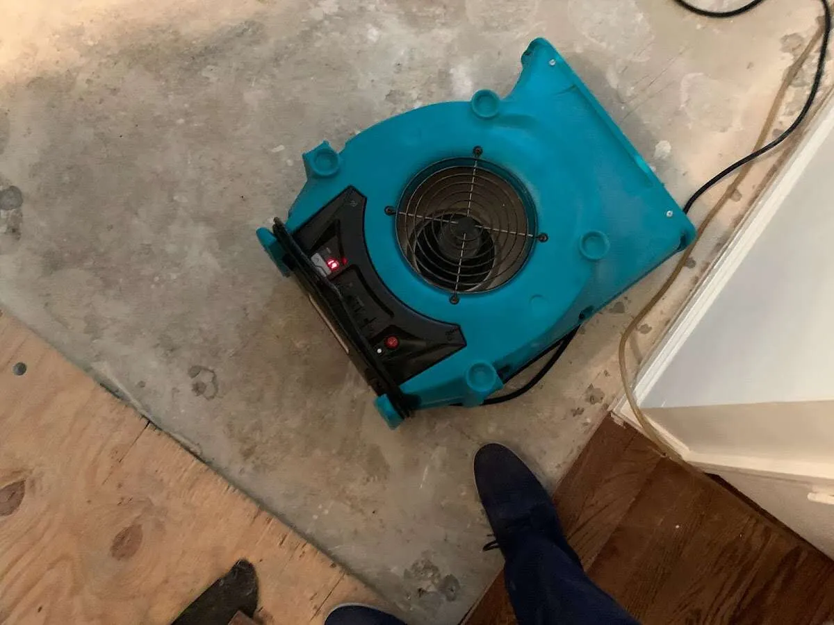 Air mover drying subfloor during Leak Detection & Repair in Sahuarita